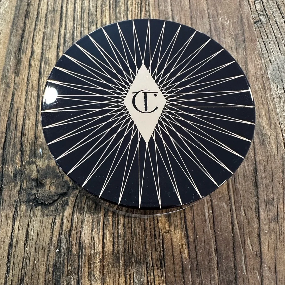 Charlotte Tilbury Magic Powder - Deep Brown Lid with Pale Pink Text